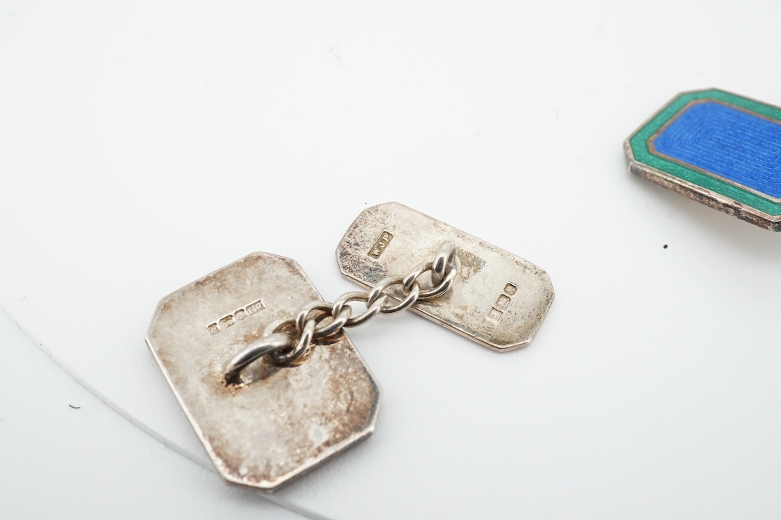 A 1970's silver identity bracelet and a modern pair of silver and two colour enamel cufflinks.